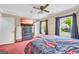 Large main bedroom featuring neutral walls, two windows, and a ceiling fan at 3121 Cruse Rd, Lawrenceville, GA 30044