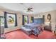 Spacious main bedroom with abundant natural light and a ceiling fan at 3121 Cruse Rd, Lawrenceville, GA 30044