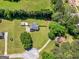 Aerial view of home showing well-manicured lawn, fenced-in backyard, and mature trees at 303 Mill Glen Ct, Mcdonough, GA 30252