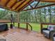 Spacious outdoor wooden deck for relaxing or entertaining at 303 Mill Glen Ct, Mcdonough, GA 30252
