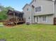 A backyard with a covered deck at 303 Mill Glen Ct, Mcdonough, GA 30252