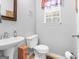 Charming bathroom features a pedestal sink and classic fixtures at 303 Mill Glen Ct, Mcdonough, GA 30252