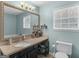 Bathroom featuring an undermount sink, granite countertop, and a large mirror at 303 Mill Glen Ct, Mcdonough, GA 30252