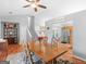 Dining room with open floor plan offers wooden furniture, neutral color scheme, and lots of light at 303 Mill Glen Ct, Mcdonough, GA 30252