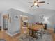 Dining room with wood floors, traditional wood furniture, and vaulted ceilings at 303 Mill Glen Ct, Mcdonough, GA 30252