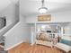 Welcoming entryway with neutral walls, hardwood floors, and a staircase on the left at 303 Mill Glen Ct, Mcdonough, GA 30252