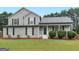 Charming two-story home with manicured lawn and attractive landscaping at 303 Mill Glen Ct, Mcdonough, GA 30252
