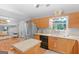 Bright kitchen featuring stainless steel appliances, an island, and seamless transition to the living area at 303 Mill Glen Ct, Mcdonough, GA 30252