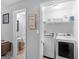 Modern laundry room with washer, dryer and ample storage at 303 Mill Glen Ct, Mcdonough, GA 30252
