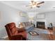 Inviting living room featuring a fireplace, hardwood floors, and neutral walls at 303 Mill Glen Ct, Mcdonough, GA 30252