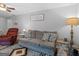 Comfortable living room with hardwood floors and ample seating at 303 Mill Glen Ct, Mcdonough, GA 30252