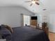 The main bedroom has light wood flooring, a vaulted ceiling, and dresser with a TV at 303 Mill Glen Ct, Mcdonough, GA 30252
