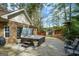 Backyard featuring a hot tub, a shed, and a well-maintained patio for outdoor enjoyment at 4360 Derrick Rd, South Fulton, GA 30349