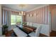 Bright dining room with large window, statement chandelier and open floor plan at 4360 Derrick Rd, South Fulton, GA 30349