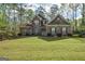 Charming brick home with a manicured lawn and mature trees at 4360 Derrick Rd, South Fulton, GA 30349