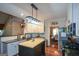 Spacious kitchen with granite countertops, island, and open view of the dining area at 4360 Derrick Rd, South Fulton, GA 30349