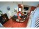 Spacious living room featuring a fireplace, a TV, and a comfortable leather sectional at 4360 Derrick Rd, South Fulton, GA 30349