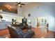 Spacious living room with high ceilings, hardwood floors, and a comfortable leather sectional at 4360 Derrick Rd, South Fulton, GA 30349