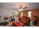 Relaxing upstairs living area with comfortable seating and access to a bathroom at 4360 Derrick Rd, South Fulton, GA 30349