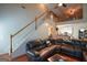 Spacious living room featuring a high ceiling, hardwood floors, and a view of the staircase and loft area at 4360 Derrick Rd, South Fulton, GA 30349