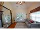 Cozy living room with a large mirror, a comfortable couch, and a view of the outdoors at 4360 Derrick Rd, South Fulton, GA 30349