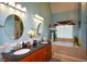 The main bath has double sinks, granite countertops, and separate tub and shower at 4360 Derrick Rd, South Fulton, GA 30349