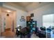 Functional home office with a desk, shelving, and natural light from a window at 4360 Derrick Rd, South Fulton, GA 30349