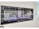 Modern electric fireplace with blue flame display against a white wall at 5364 Tolar Road # 74, South Fulton, GA 30213