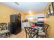 This kitchen features white cabinets, and black appliances at 361 Cecil Hunter Rd, Moreland, GA 30259