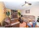 Inviting living room featuring a brick fireplace, comfortable seating, and neutral decor at 361 Cecil Hunter Rd, Moreland, GA 30259
