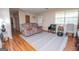 The living room features laminate floors, with both a sofa and a collection of chairs at 361 Cecil Hunter Rd, Moreland, GA 30259