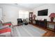 Comfortable living room with modern furniture, laminate floors, and a large window at 361 Cecil Hunter Rd, Moreland, GA 30259