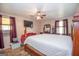 Cozy bedroom featuring a comfortable bed and ceiling fan, creating a relaxing and inviting atmosphere at 361 Cecil Hunter Rd, Moreland, GA 30259