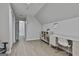 Open concept bedroom with light gray walls, wood floors, an office space, and a closet at 214 Windgate Ct, Peachtree City, GA 30269