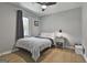 Cozy bedroom with a neutral color scheme, featuring a queen-sized bed and a window for natural light at 214 Windgate Ct, Peachtree City, GA 30269