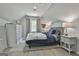 Bright bedroom featuring a comfortable bed, side tables, a closet, and gray walls at 214 Windgate Ct, Peachtree City, GA 30269