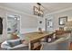 Formal dining room featuring a wooden table, decorative seating, and a modern chandelier at 214 Windgate Ct, Peachtree City, GA 30269