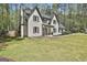 Attractive two-story home with a well-manicured lawn and surrounding trees at 214 Windgate Ct, Peachtree City, GA 30269