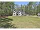 Spacious two-story home with a large, well-maintained lawn and mature trees at 214 Windgate Ct, Peachtree City, GA 30269