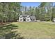 Spacious two-story home with a large, well-maintained lawn and mature trees at 214 Windgate Ct, Peachtree City, GA 30269