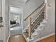 Bright foyer with a staircase and an open doorway to a living area with a television at 214 Windgate Ct, Peachtree City, GA 30269