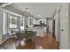 Bright eat-in kitchen featuring white cabinets, an island, and a lovely breakfast nook with bay windows at 214 Windgate Ct, Peachtree City, GA 30269