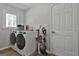 Functional laundry room featuring modern appliances and storage solutions with plenty of space at 214 Windgate Ct, Peachtree City, GA 30269
