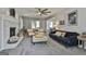 Inviting living room featuring a fireplace, comfortable seating, and sliding glass doors at 214 Windgate Ct, Peachtree City, GA 30269