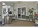 Sunroom with a desk area, lots of natural light, wood floors, and a sliding glass door at 214 Windgate Ct, Peachtree City, GA 30269