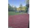 A house back deck overlooks a lush green yard with picturesque views of a tranquil lake at 2316 Emerald Dr, Jonesboro, GA 30236