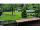 A vast backyard view featuring a boat house, lush lawn, and access to the water at 2316 Emerald Dr, Jonesboro, GA 30236
