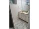 Bathroom with marble floors, a dual sink vanity, and large mirror at 2316 Emerald Dr, Jonesboro, GA 30236