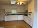 Bright kitchen with white cabinets, granite countertops, and stainless steel appliances at 2316 Emerald Dr, Jonesboro, GA 30236