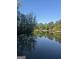 Scenic lake view with tree-lined shores reflecting on the water at 2316 Emerald Dr, Jonesboro, GA 30236